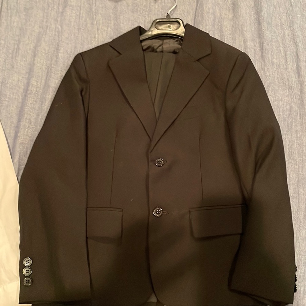 Black suit boy size 5-6. Blazer and pants used once for funeral.